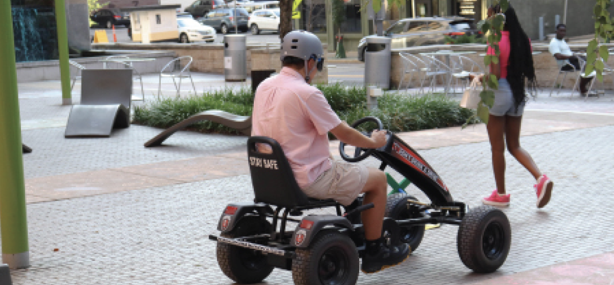 A student driving a “Drunk Buster,” which simulates the feeling of driving under the influence.